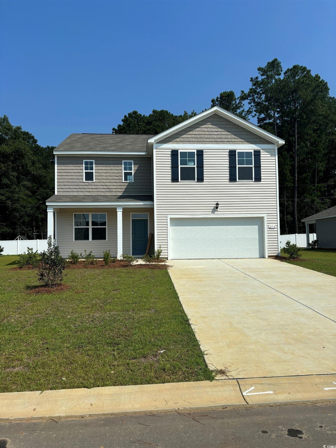View of front of property featuring a front lawn a