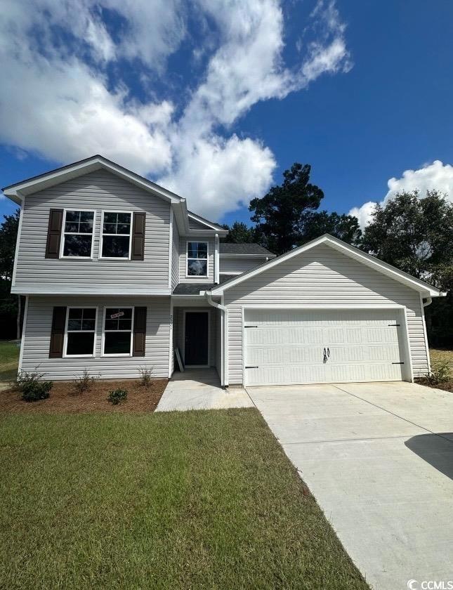 View of front of home featuring a garage and a fro