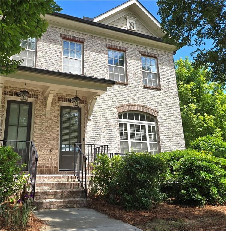 View of front of house with brick siding