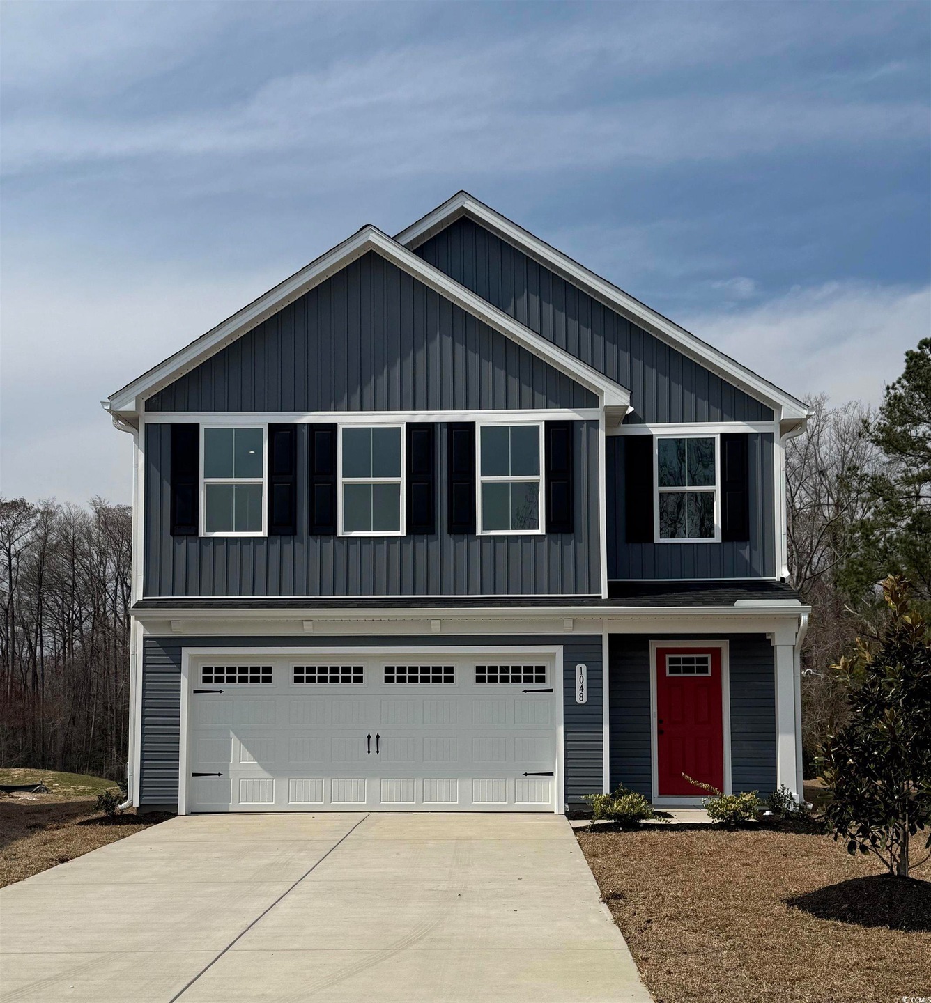 View of front facade featuring a front yard and a 