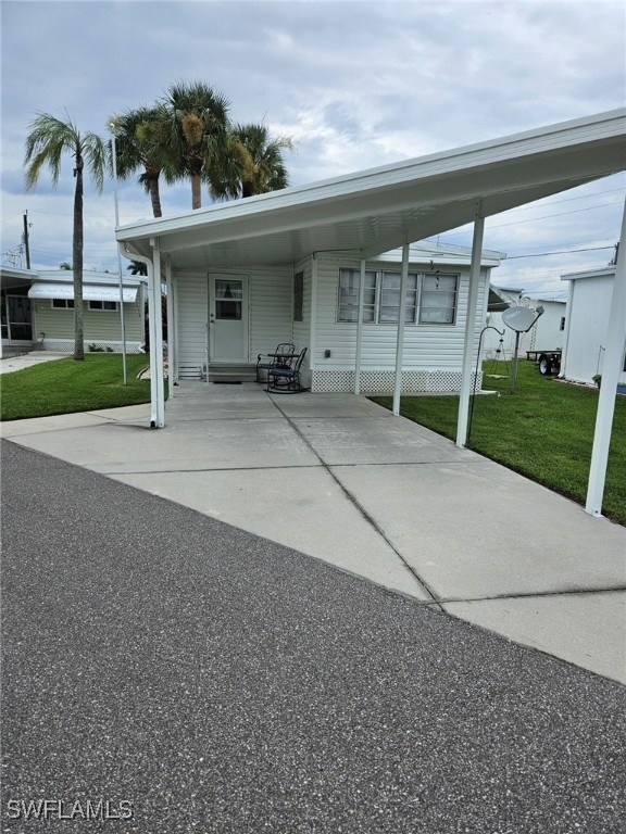 View of front of property with a carport and a fro