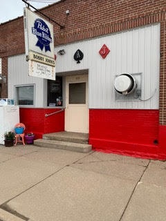 front entrance with sign