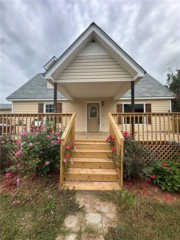 View of front of home with a deck