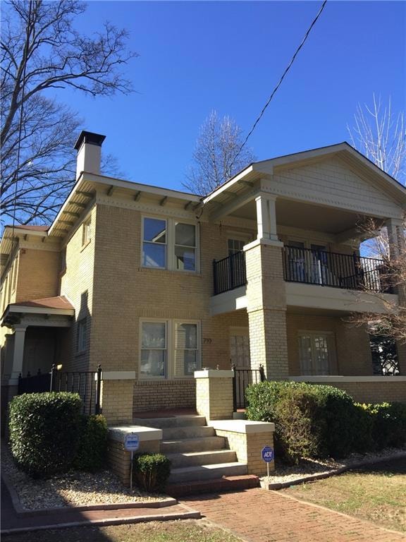 View of front of house featuring a balcony