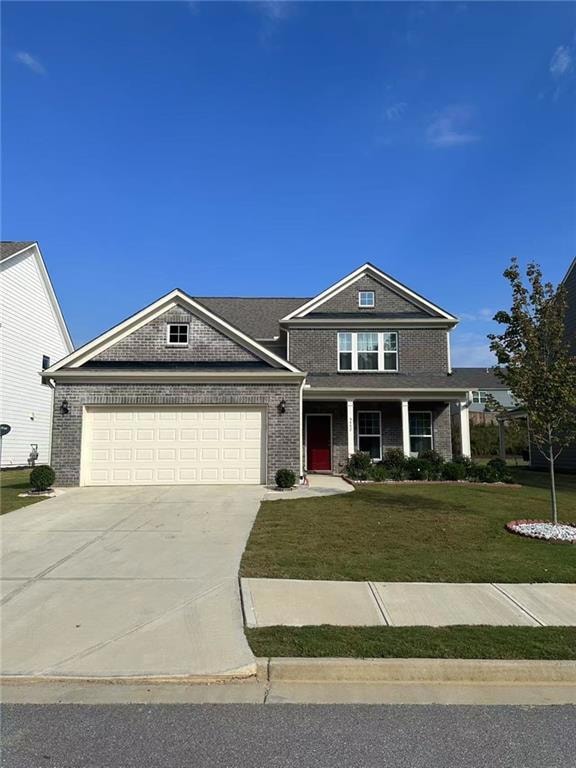 View of front facade featuring an attached garage,