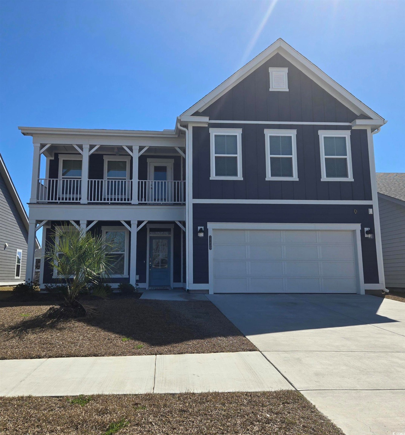 View of front of property with board and batten si