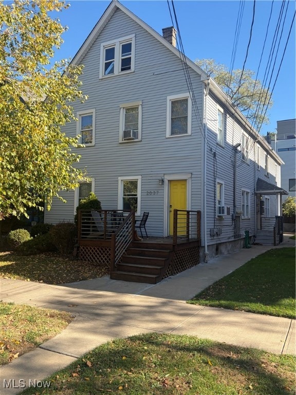 View of front of property featuring a chimney