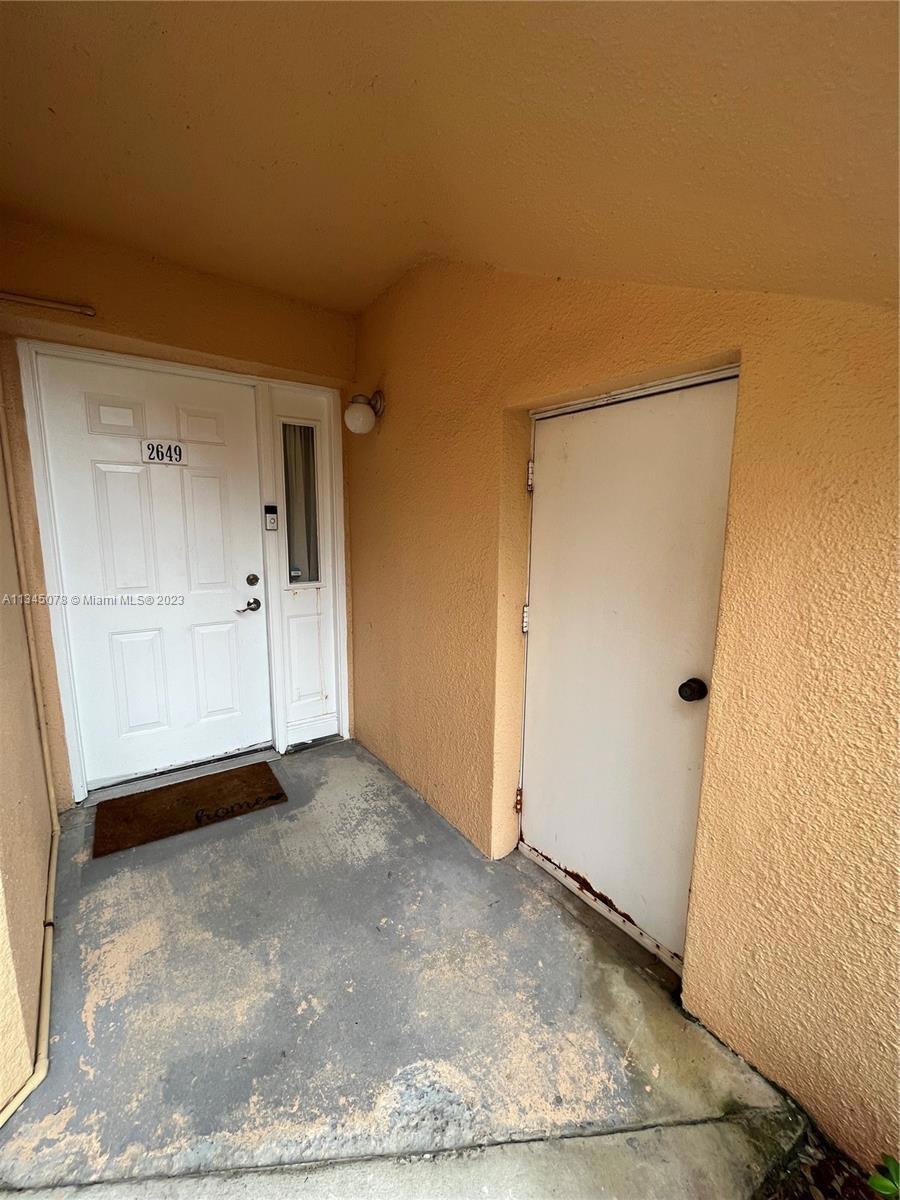 Front door and storage closet