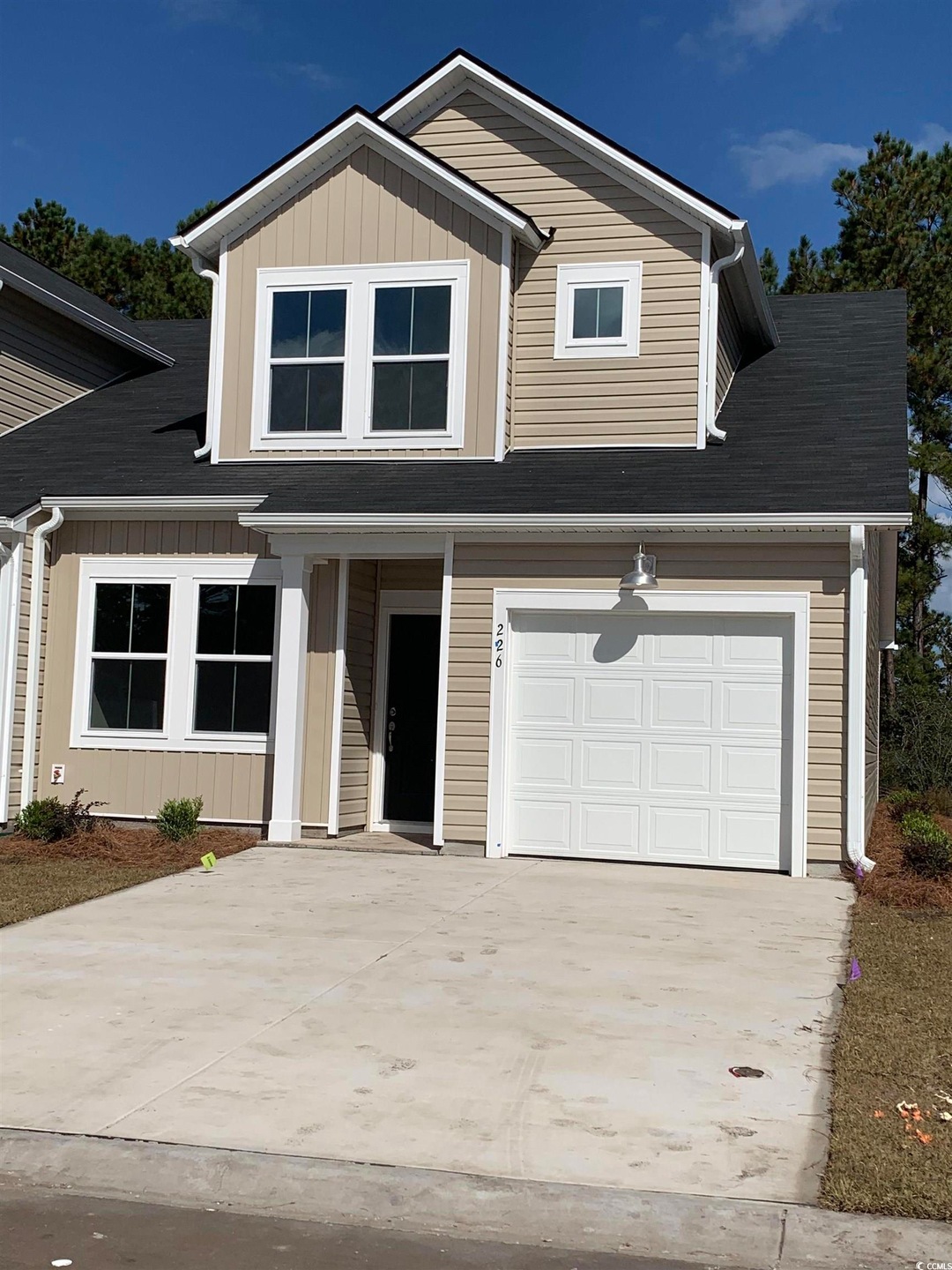 View of front facade featuring a garage