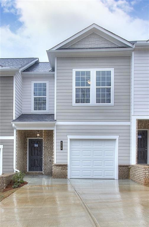 Townhome / multi-family property with a garage
