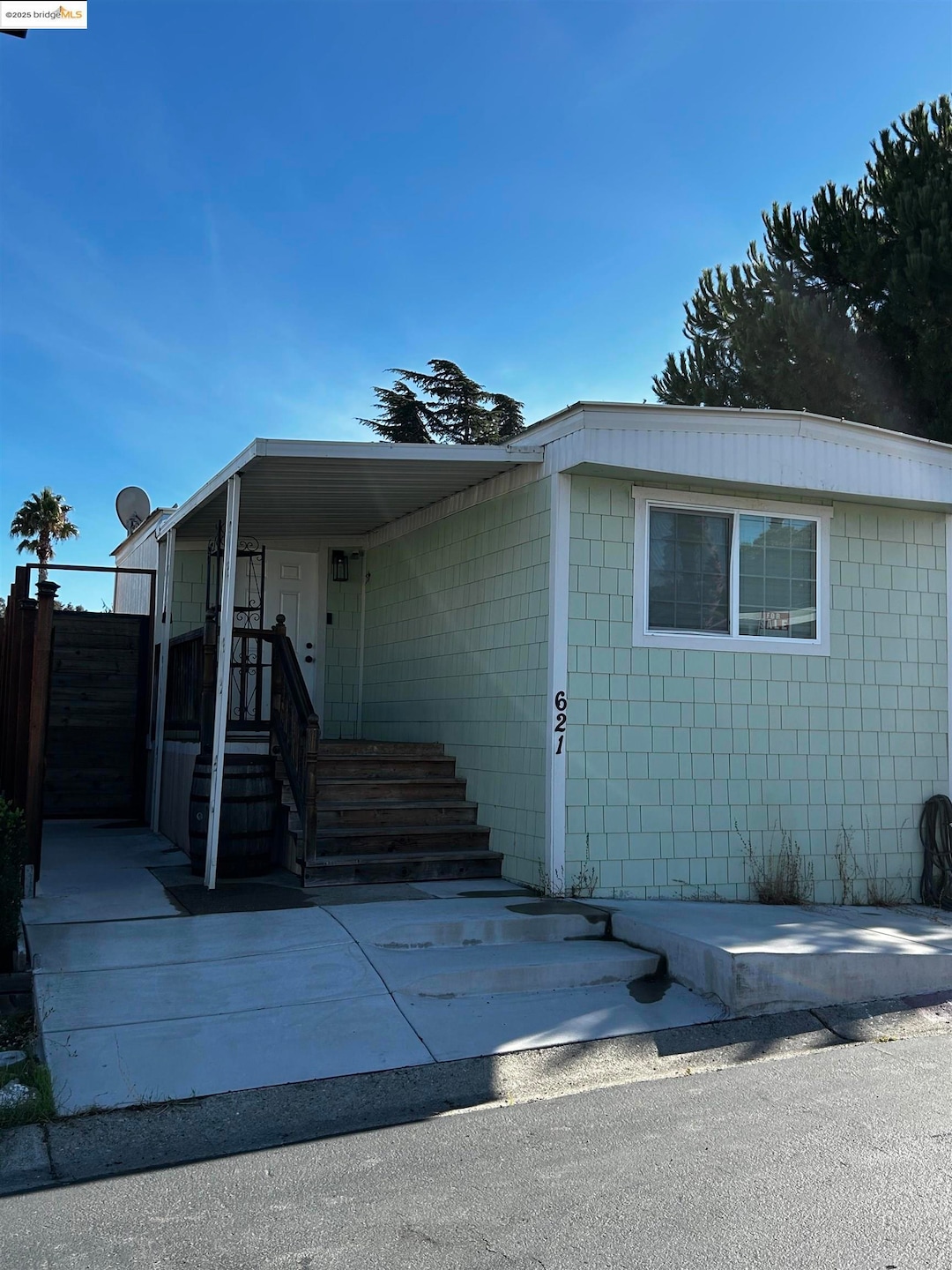View of front facade featuring concrete block siding