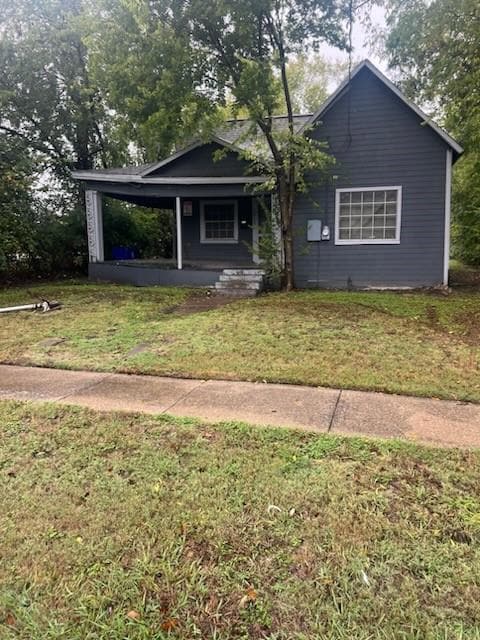 View of front of property with a front yard