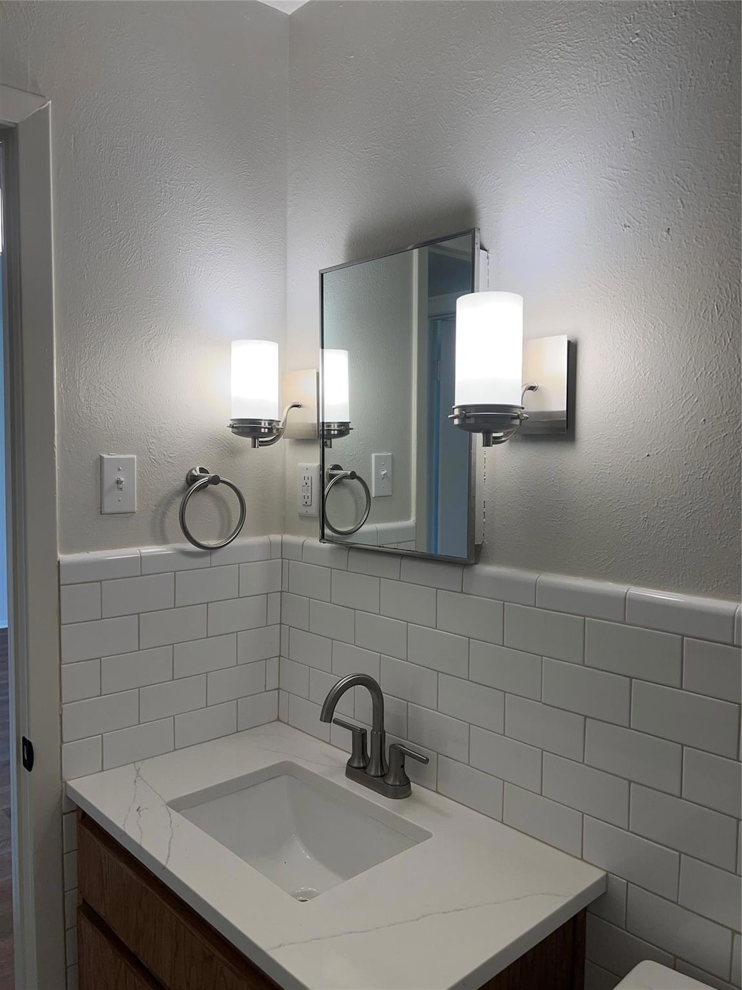 This bathroom features a modern vanity with a clea