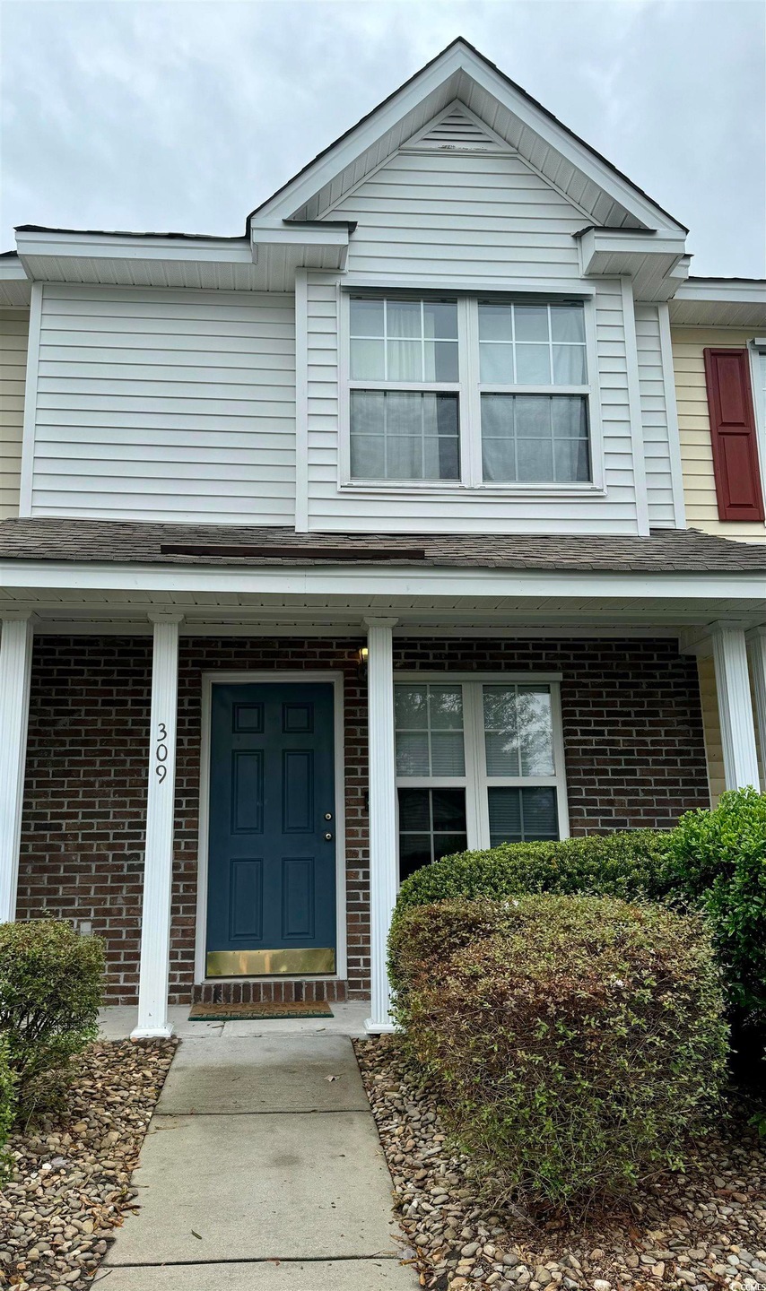View of front of property with a porch