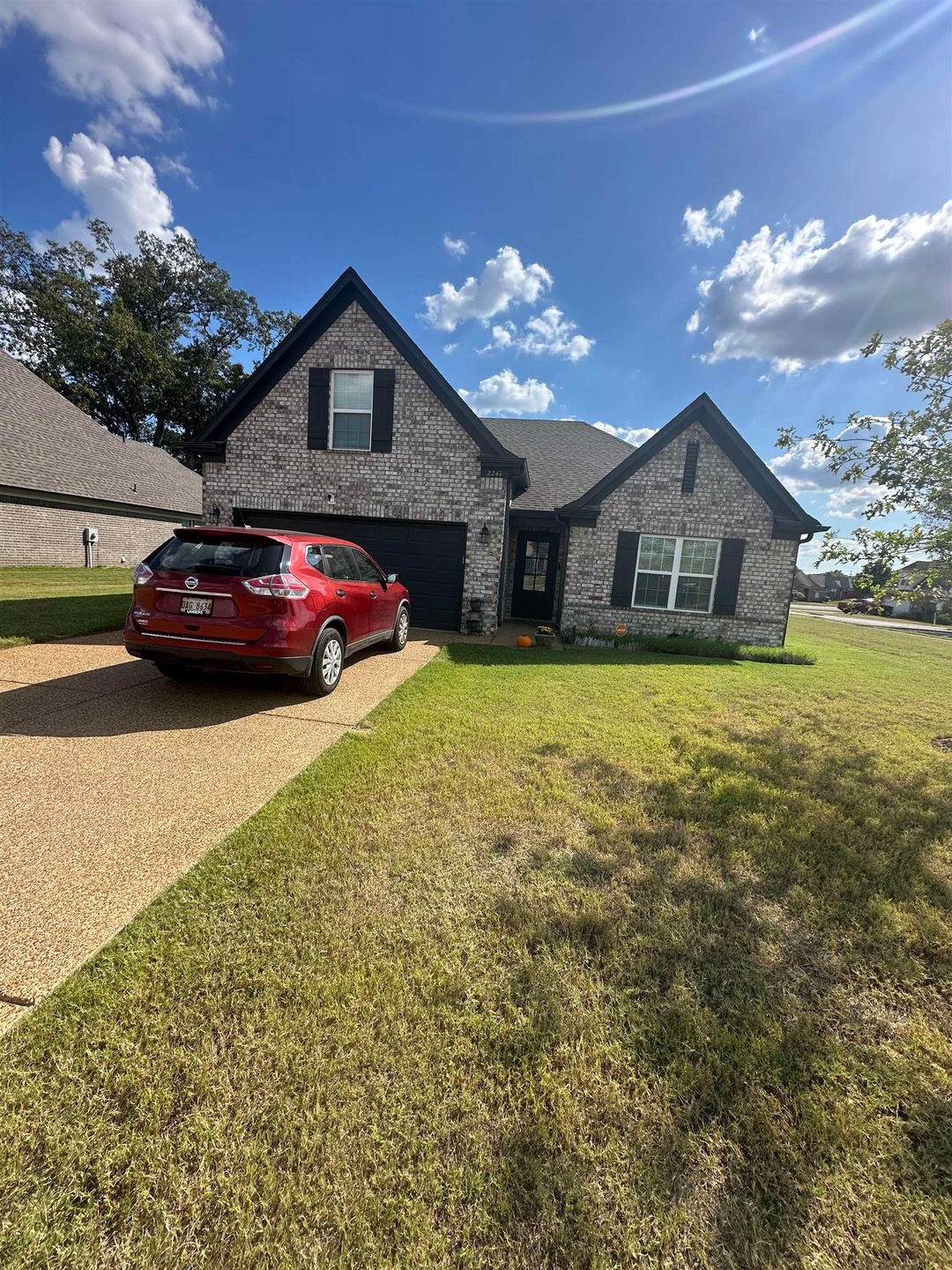 View of front of property featuring a garage and a