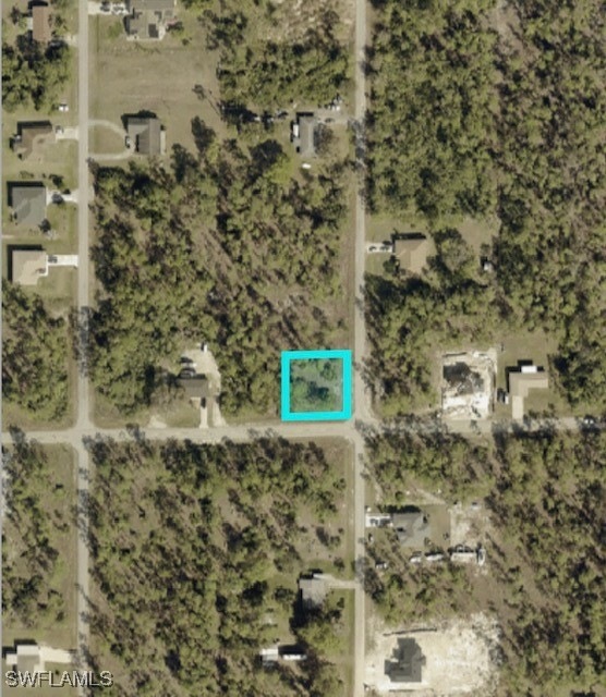 Aerial overview of property's location with property parcel outlined