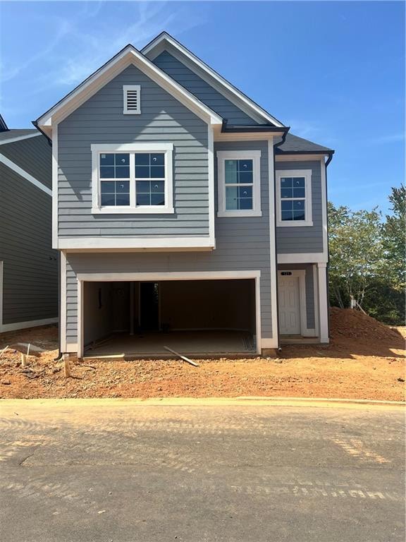 View of front of property featuring a garage