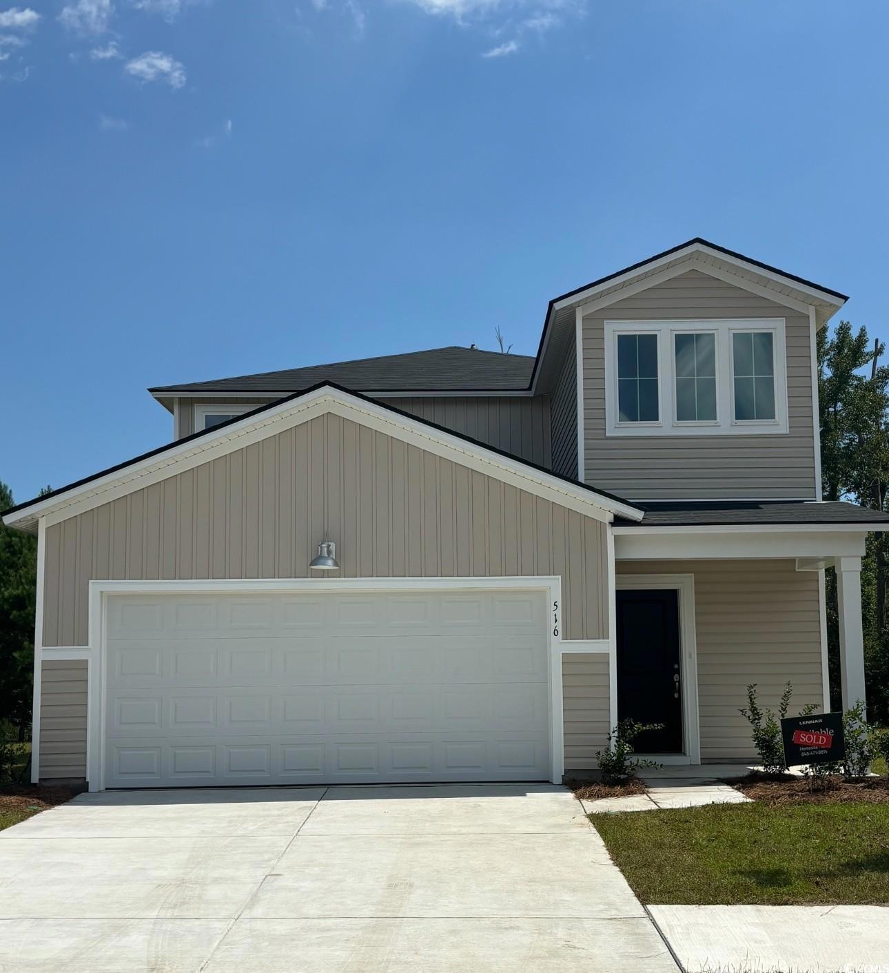 View of front of home featuring a garage