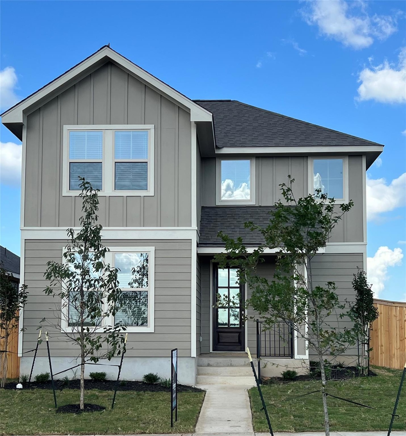 View of front facade with board and batten siding