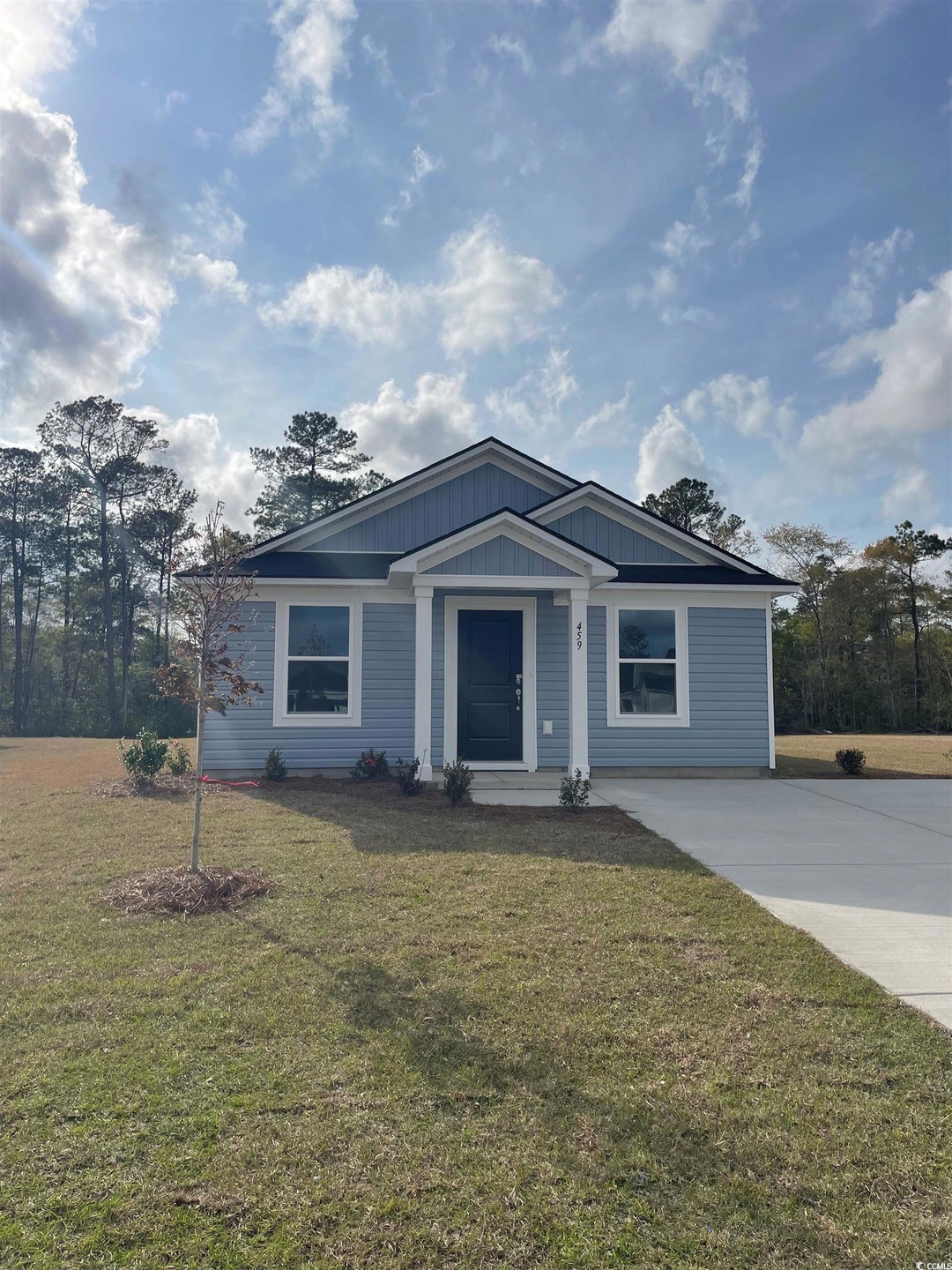 View of front of home with concrete driveway and a