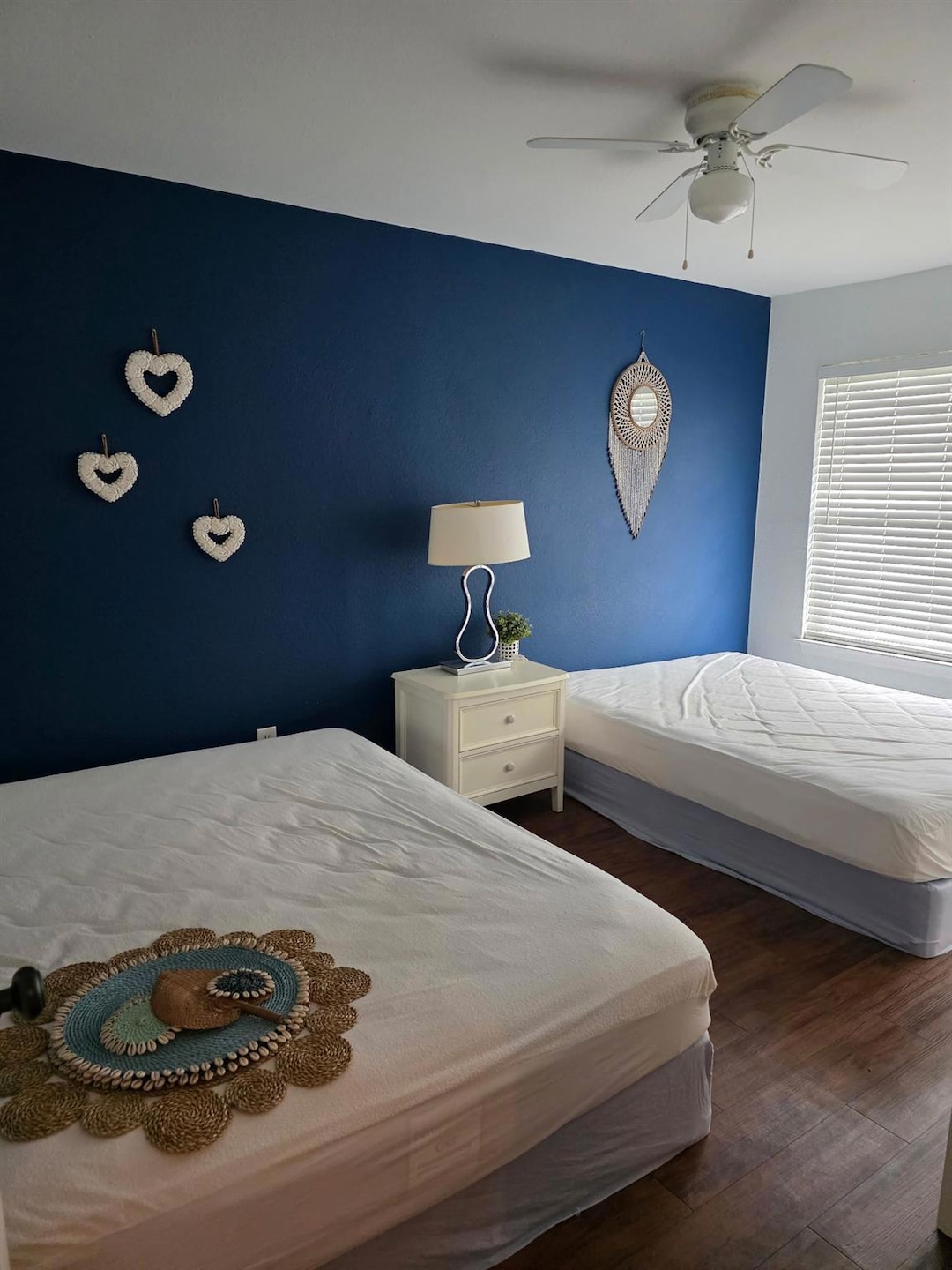 Bedroom with wood finished floors and ceiling fan