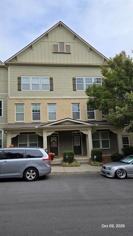 View of front of house featuring board and batten siding