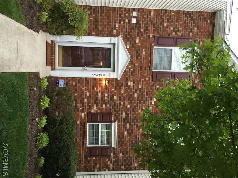 Brick front entrance to this beautiful 3 story tow