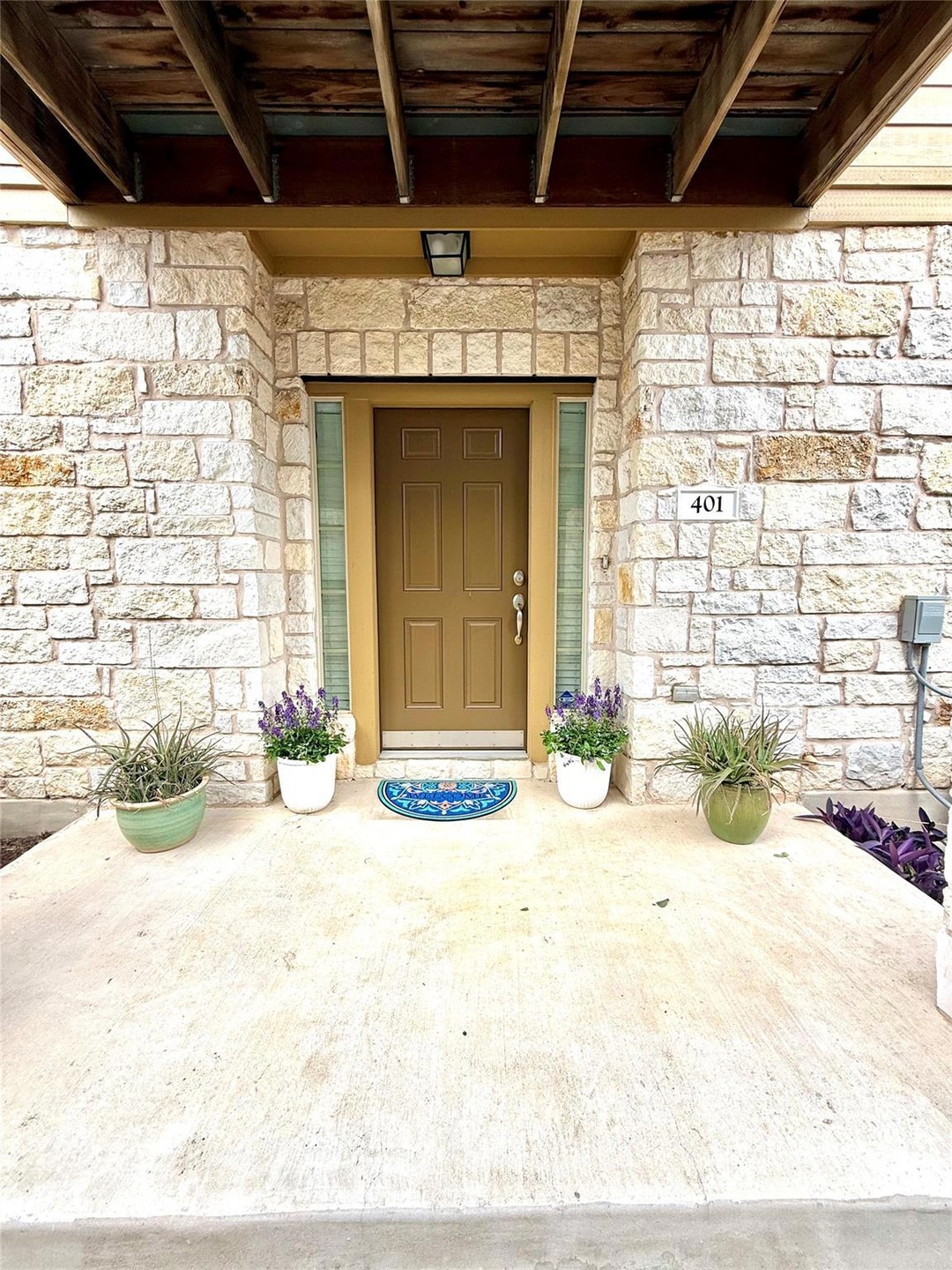 Property entrance with stone siding