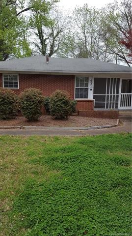 Brick house with screened porch off living room