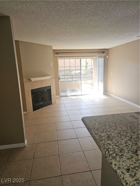 Unfurnished living room with a textured ceiling, l