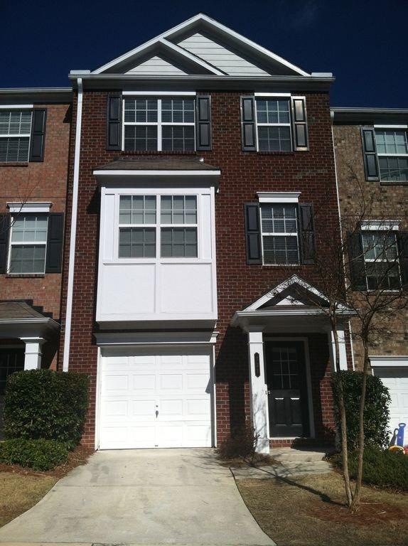 This beautiful brick townhome in gated Heritage Pa