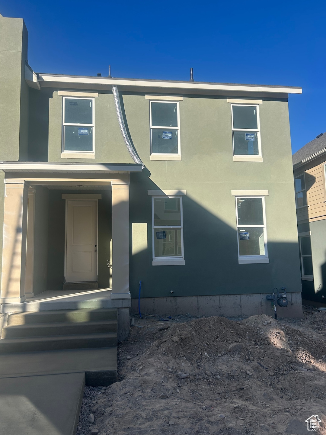 View of front of property featuring stucco siding
