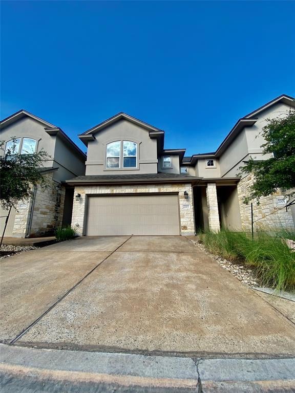 View of front facade featuring an attached garage