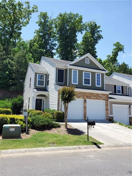 Nice end unit with 2 car garage; Driveway can fit 