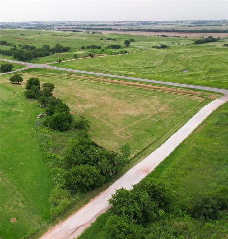 Birds eye view of property with a rural view