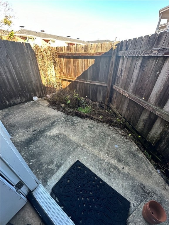 View of yard with a patio and fence
