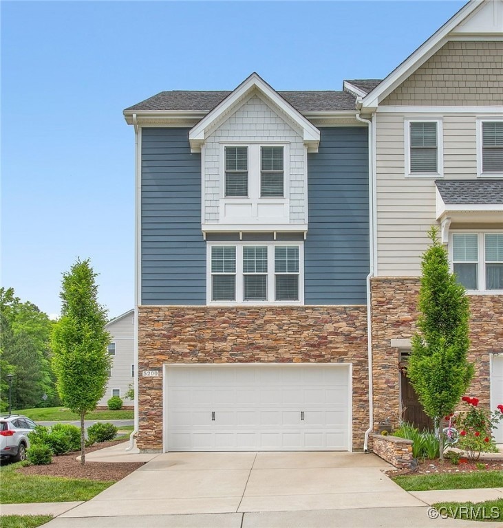 View of front facade featuring stone siding, concr