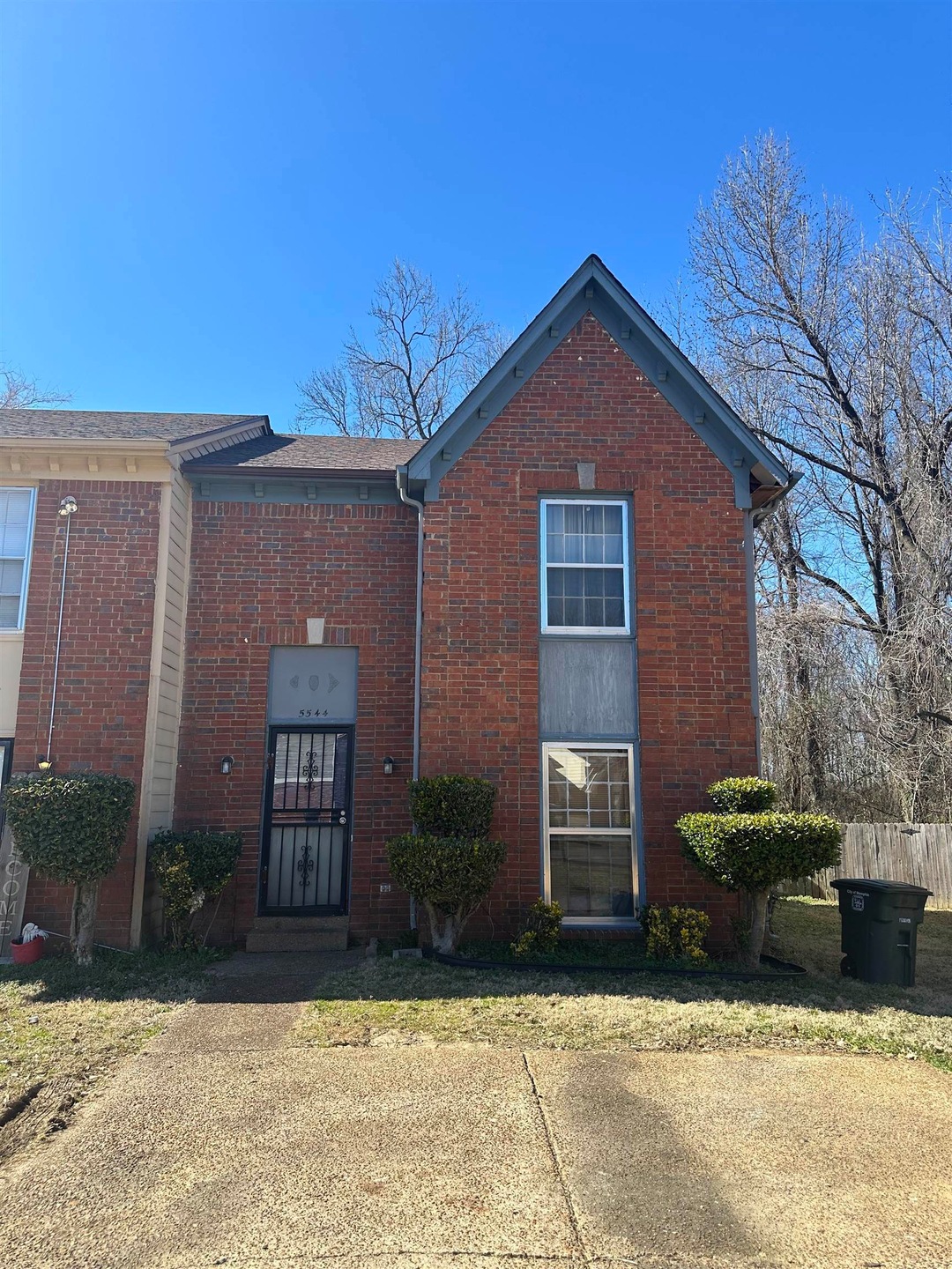 Traditional-style house featuring brick siding