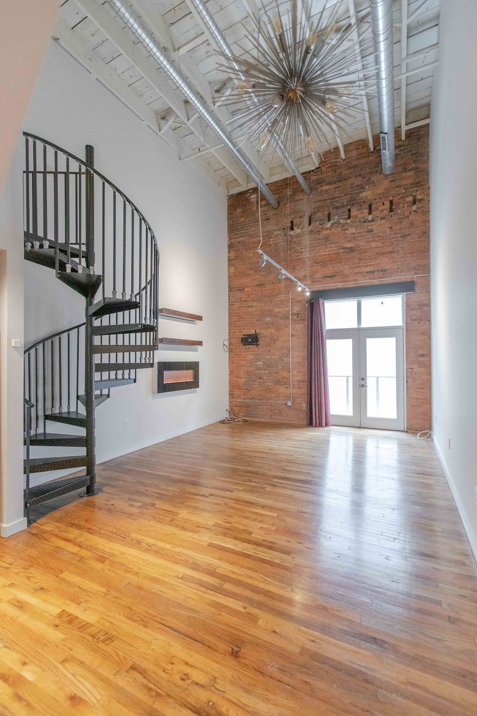 Light Bright and Freshly painted! 23' Ceilings, Gleaming Hardwoods and Exposed Brick! Gorgeous!