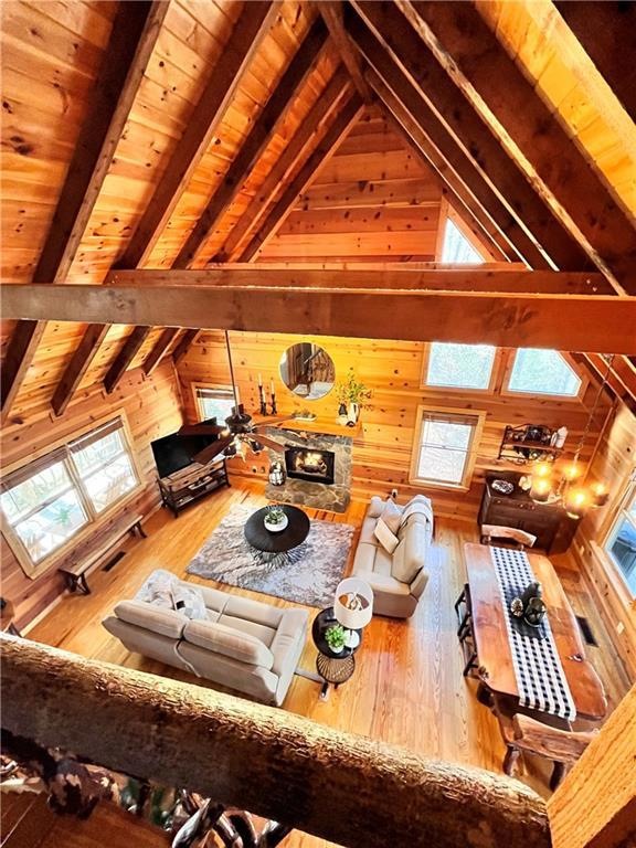 Stunning view of great room with beamed ceilings a