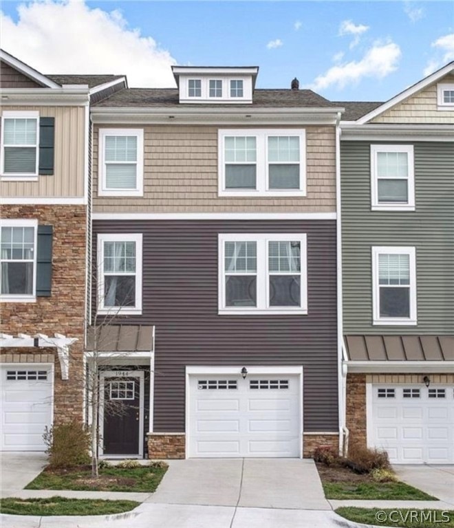View of property with a garage