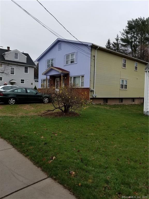 Street view, detached 2 car garage in rear, plus r