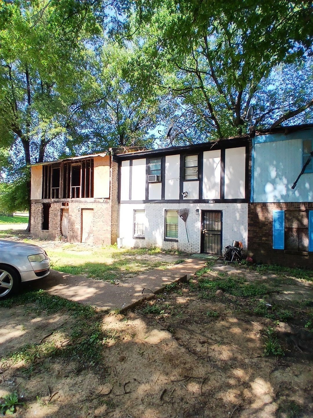 View of front of home with brick siding and stucco siding