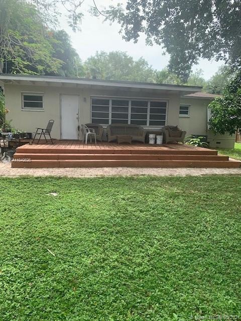large wood deck looking over huge back yard