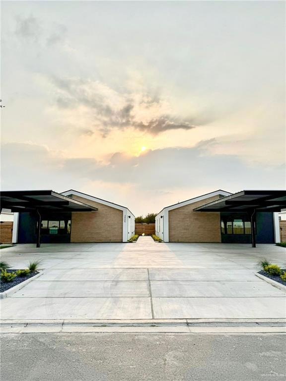 View of front of property featuring a carport