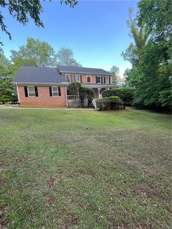 View of front facade featuring brick siding and a 