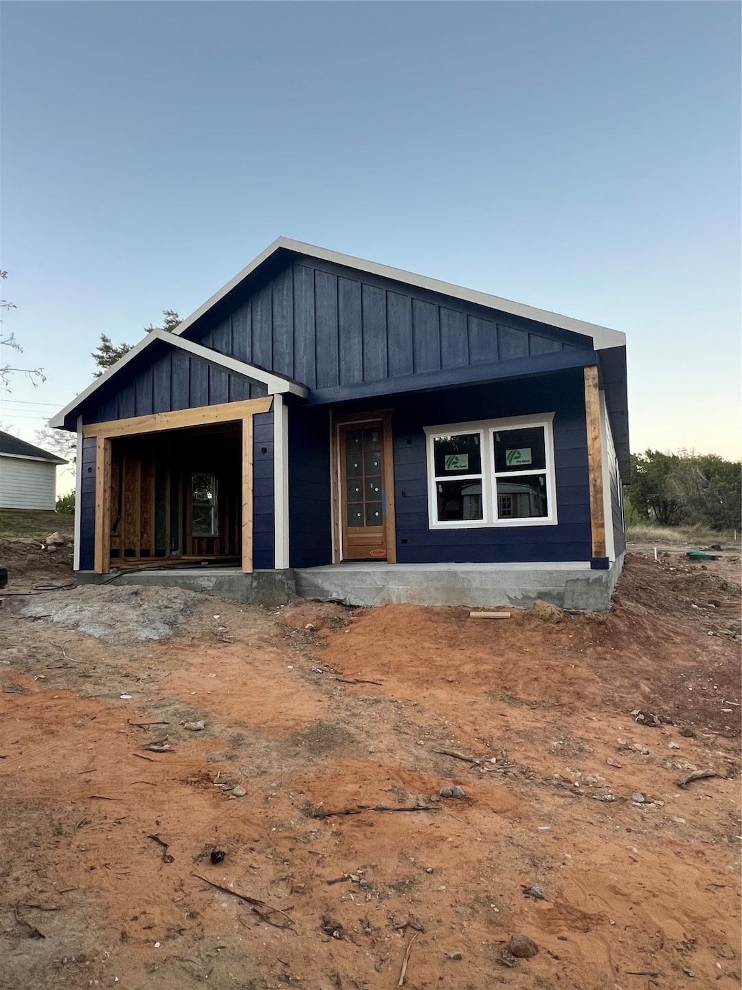 View of front of property featuring board and batten siding and a porch