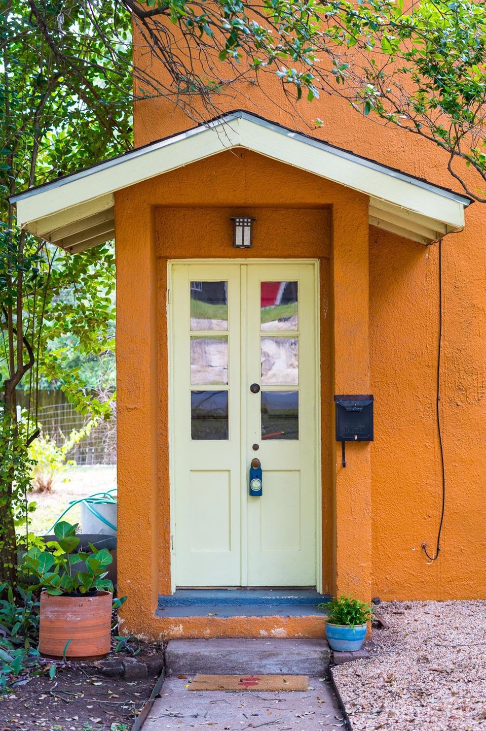 View of exterior entry with stucco siding