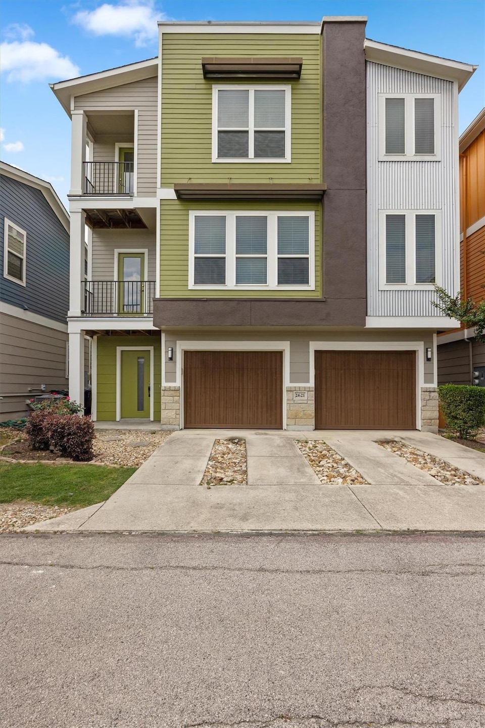Townhome / multi-family property with driveway, a