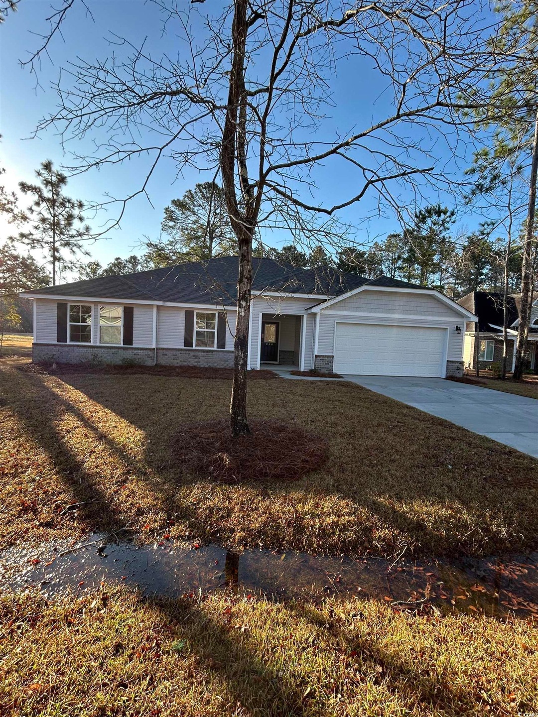 Ranch-style house featuring an attached garage and
